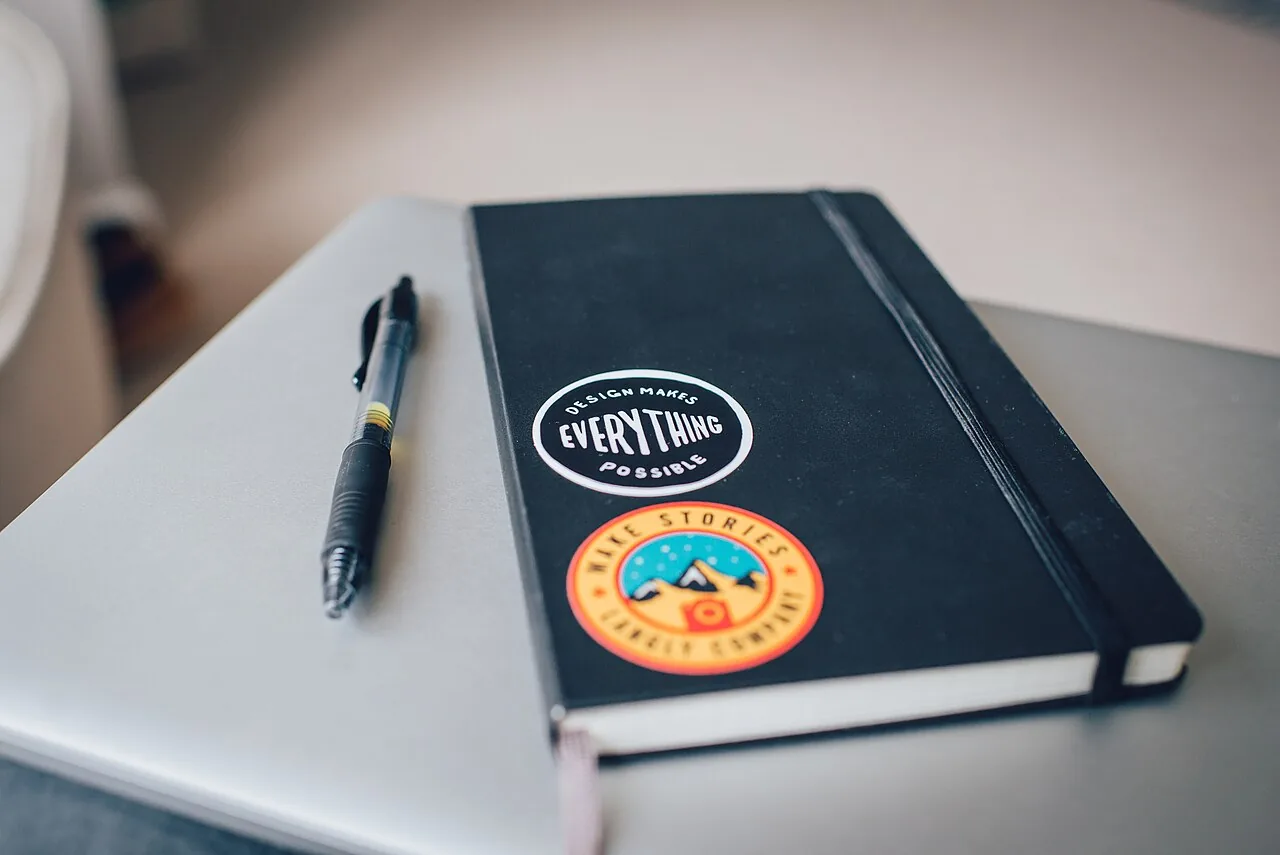Stickers on a notebook (Unsplash)